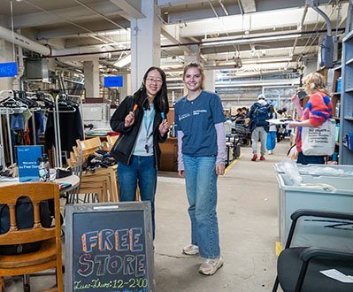 Two students pose for a photo at the Free Store.